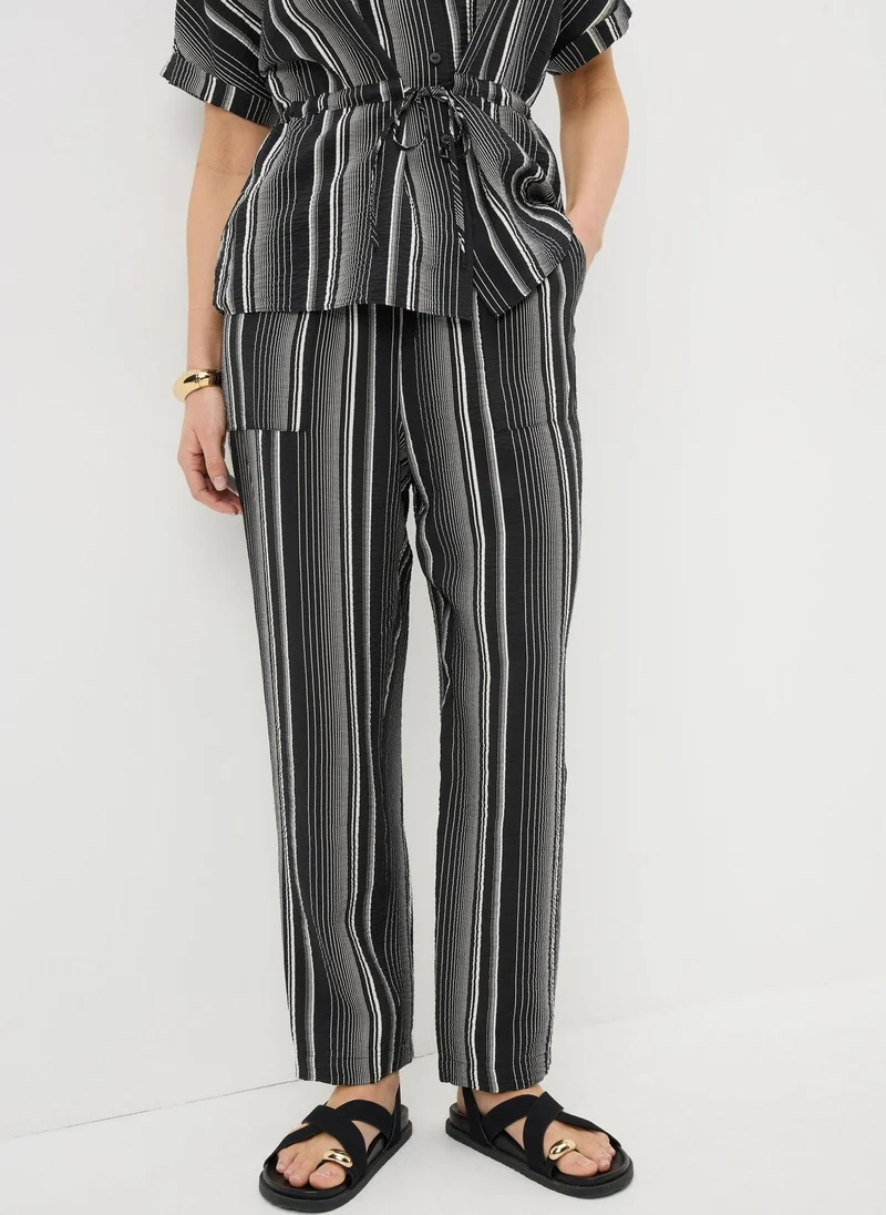 اشتري ماتلان Black/White Black Stripe Airflow Tapered Co Ord Trousers للنساء في الإمارات