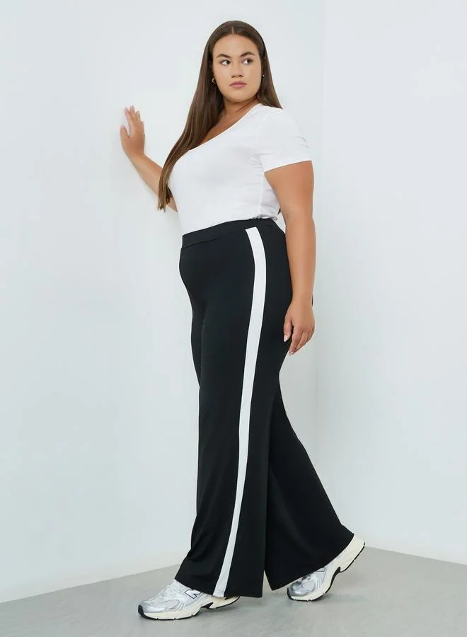 Plus Size Side Stripe Flared Leggings