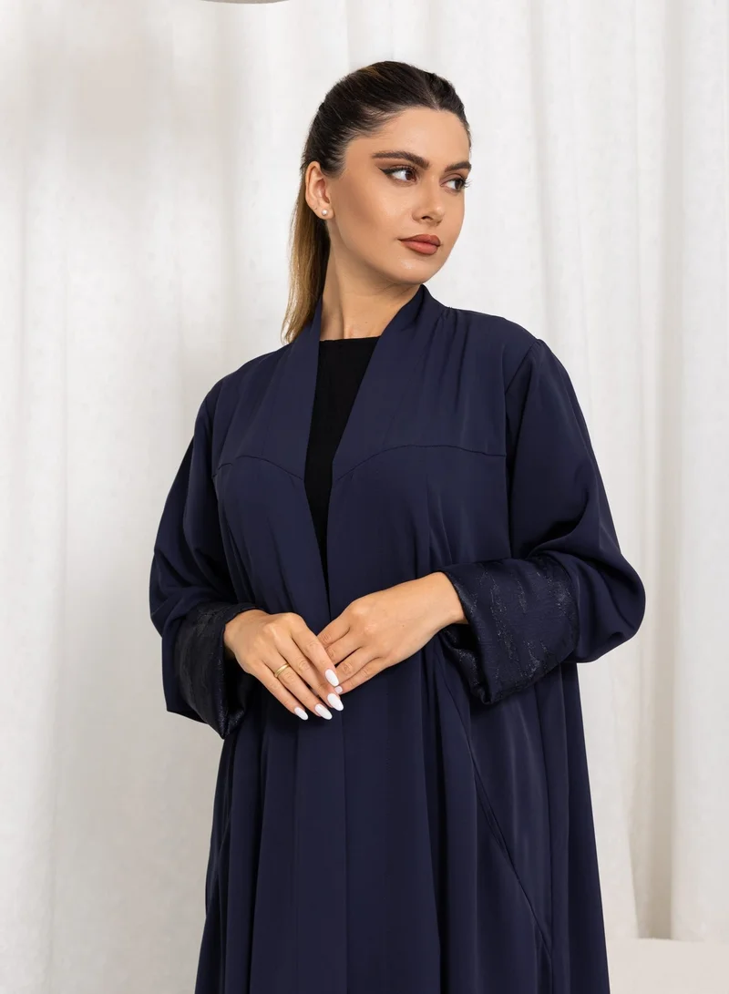 Nida fabric with cuts and pockets, Jaquard folding on sleeves