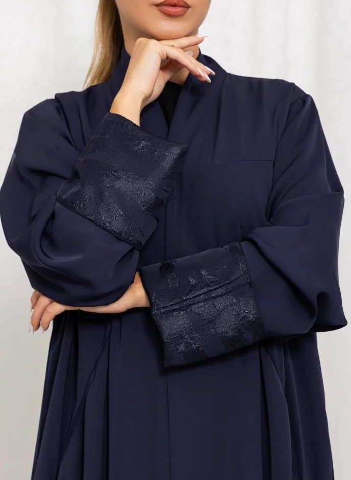 Nida fabric with cuts and pockets, Jaquard folding on sleeves
