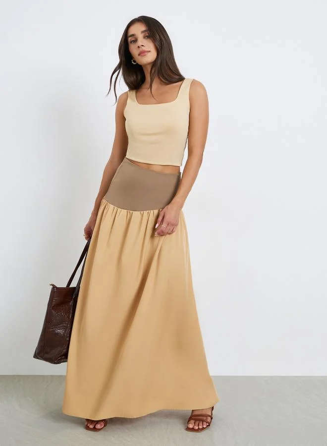 تنورة طويلة بكسرات