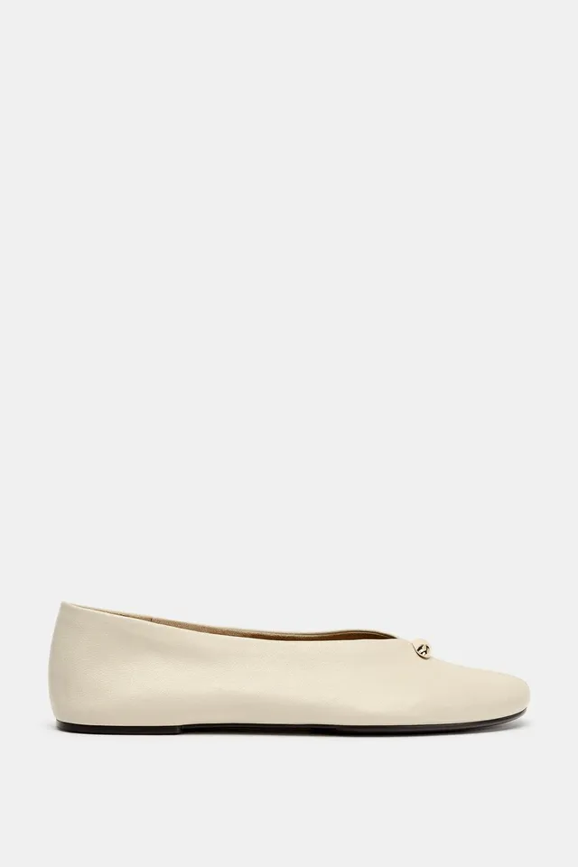 LEATHER BALLERINAS WITH METAL APPLIQUÉ