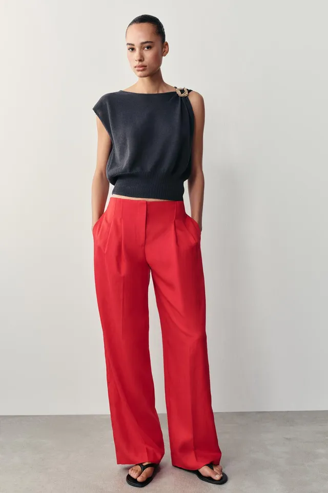 KNIT TOP WITH METALLIC TRIMS