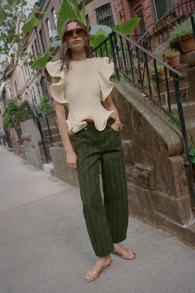 KNIT TOP WITH WAVY TRIMS
