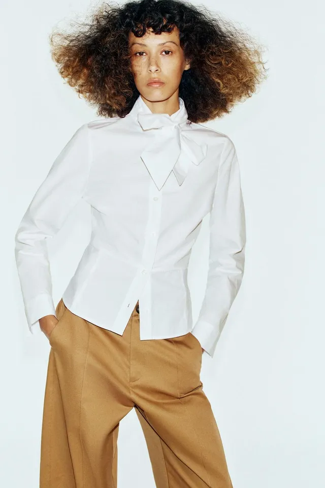 PEPLUM SHIRT WITH TIED DETAIL