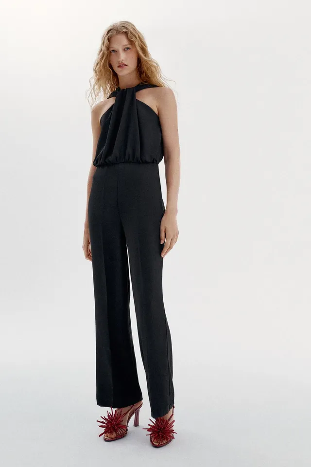 TWIST NECK FLARE JUMPSUIT