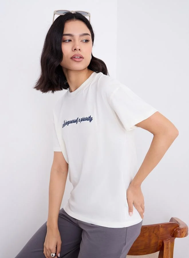 Styli Embroidered Slogan Boxy Fit T-Shirt Cream