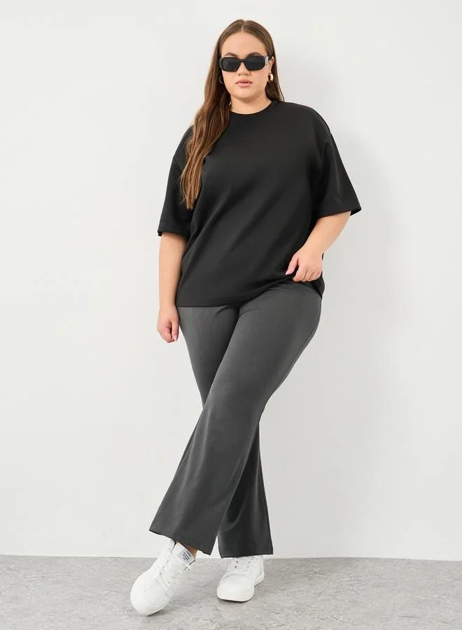 Plus Size Criss-Cross High Rise Flared Pants Black
