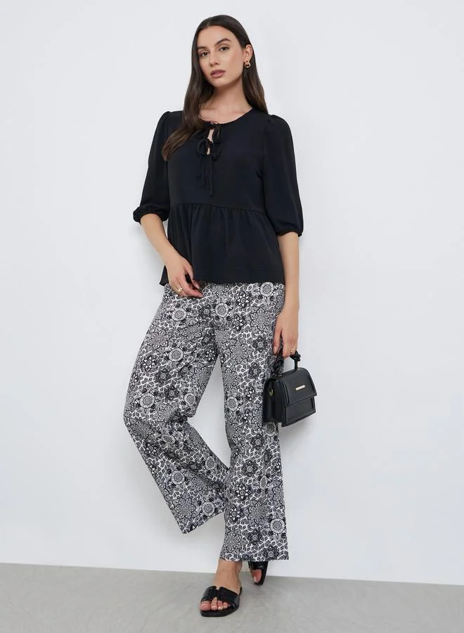 Take Two Ruffle Hem Top and Printed Pants Set Black